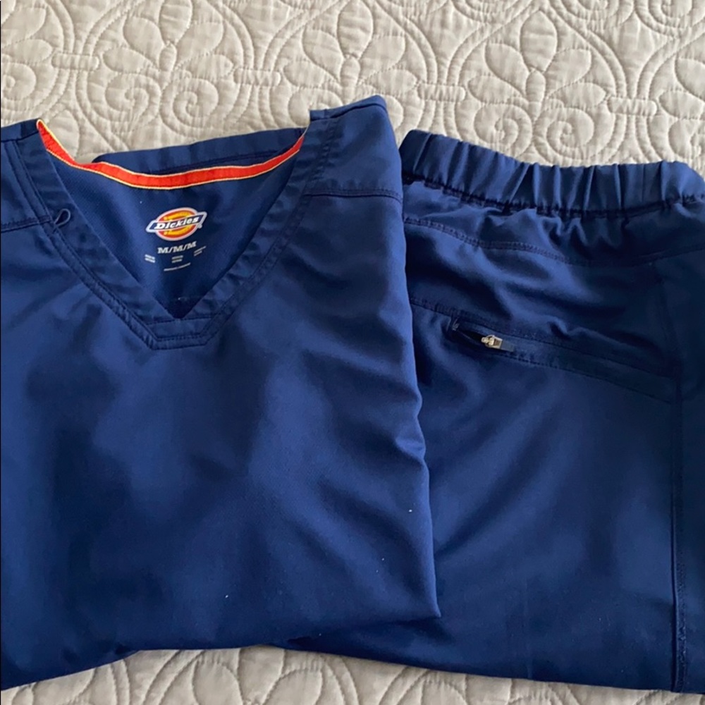 Dickies navy blue scrub set with tall bottoms.